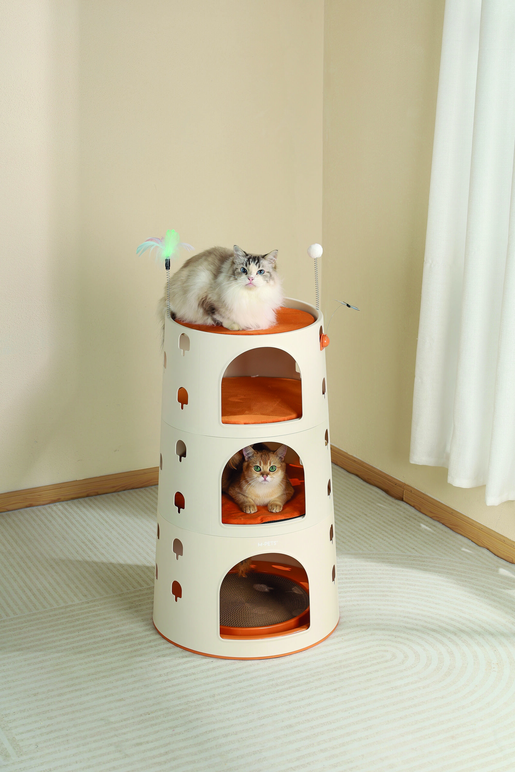 A playful tabby cat climbs and lounges on the multi-level BURANA Eco Cat Tower, crafted with 99% recycled plastic. Features sisal scratching posts, plush platforms, and a spacious design, perfect for multiple cats.